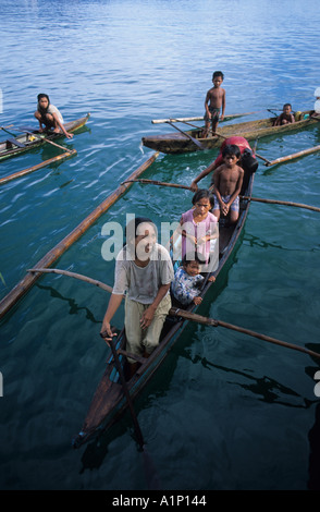 Badjao Badjau or Tau Laut sea gypsies children Puerto Princesa Palawan Philippines In outrigger canoe Dive for coins thrown into Stock Photo