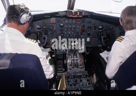 Pilot and co pilot on flight deck of passenger jet airliner Stock Photo