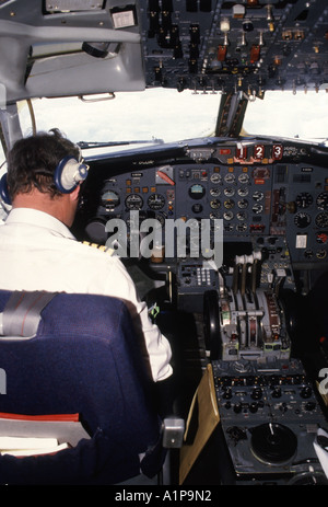 Historical archival year 2005 view for passengers to see Aircrew sitting in flight deck cockpit before take-off for start of a holiday journey abroad Stock Photo