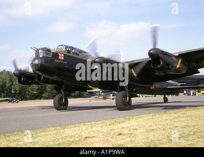 Wartime preserved Avro Lancaster bomber City of Lincoln of the Battle of Britain Memorial Flight prepares to commence airshow flypast Kent England UK Stock Photo