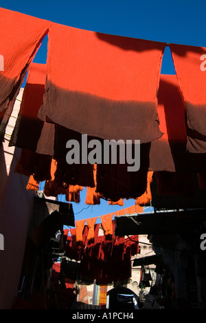 Scarves hung out for drying in the clothing tanneries district of the Medina of Marrakech, Morocco Stock Photo