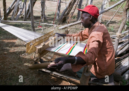 A man weaving cloth on a tradtional loom in the village of Oshko Ethiopia Stock Photo