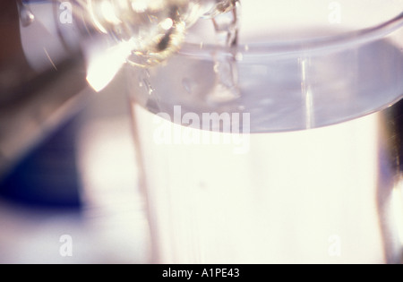 Water being poured into glass, close-up Stock Photo