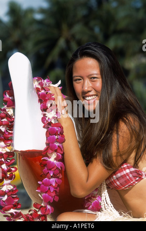 Traditional hula dancers (model released) in performance with ipu (drum
