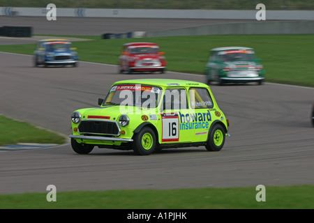 Mini Racing Cars racing around a circuit Stock Photo - Alamy