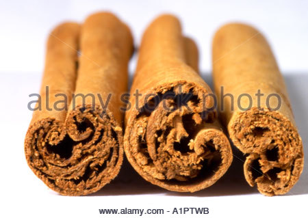 Three cinnamon sticks on a white background Stock Photo