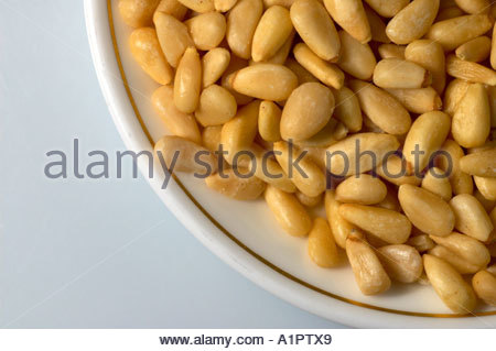 A number of pine nuts on a dish Stock Photo
