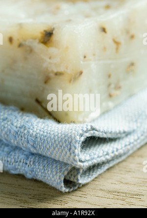 Bar of soap and towel, extreme close-up Stock Photo