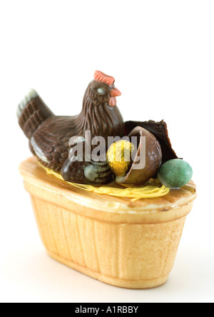 Chocolate chickens and eggs in basket Stock Photo