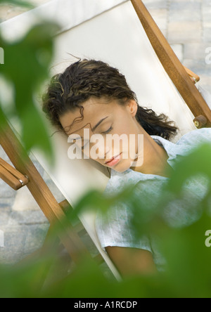 Woman sleeping in deckchair Stock Photo