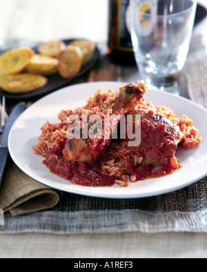 Spiced fried chicken with rice and plantain Stock Photo