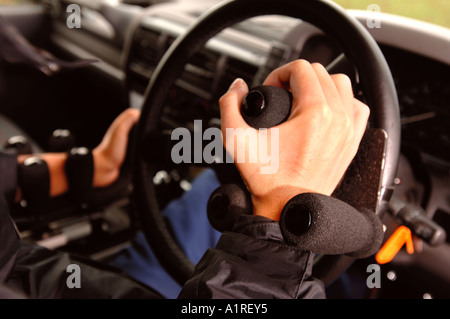 A MOTOR CARS DRIVING CONTROLS ADAPTED FOR A DISABLED DRIVER Stock Photo