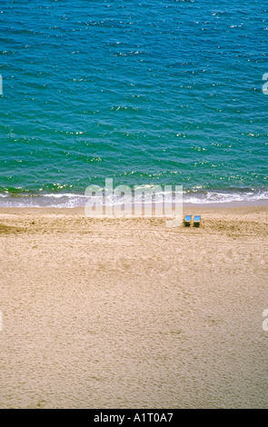 Two deck chairs on the sandy beach Bournemouth Dorset England Stock Photo