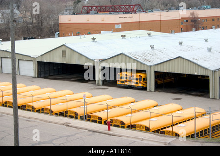 Line up of orange school buses in the motor pool St Paul Minnesota USA Stock Photo