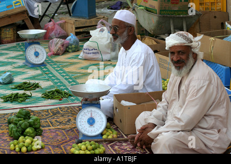 Men selling fruit and vegetables in a souq in Sinaw, near Nizwa,  Oman Stock Photo