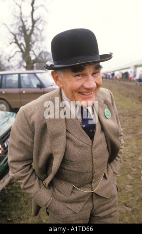 Tweed suit, waistcoat, bowler hat and watch chain, man wearing country clothes. Badminton Horse trials Gloucestershire England 1985. 1980s UK Stock Photo