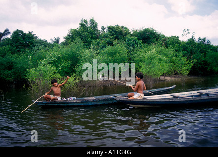 2, two, Brazilian boys, boys, friends, fishing, dugout canoe, Obim Lake, Amazon River Basin, Amazonas State, Brazil, South America Stock Photo