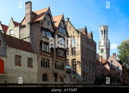Old red brick buildings with the Belfry behind in the lovely medieval city of Bruges Stock Photo