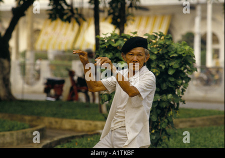 VIETNAM HO CHI MINH CITY OLDER MAN DOING EARLY MORNING EXERCISES Stock Photo