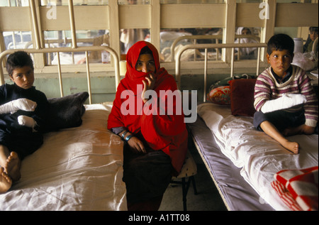 MINES IN AFGHANISTAN .JAMULLADIN AND FRIEND BOTH LAND MINE VICTIMS INDIRA GANDHI HOSPITAL KABUL 1996 Stock Photo
