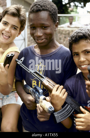 MOZAMBIQUE MAPUTO BOYS PLAYING WITH TOY GUNS Stock Photo