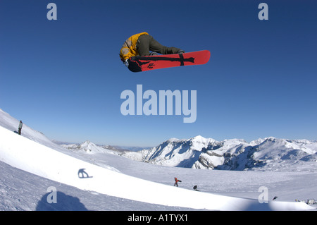 Snowboarder Thomas Wyden jumping on the glacier of  Laax Stock Photo