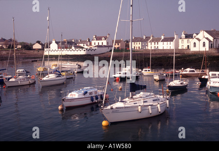 Isle of Whithorn in the Machars of Galloway yachts sitting at moorings with village behind Stock Photo