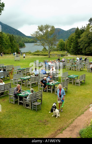 Diners and dogs outdoors at the Jordan Pond House in Acadia National Park USA Stock Photo