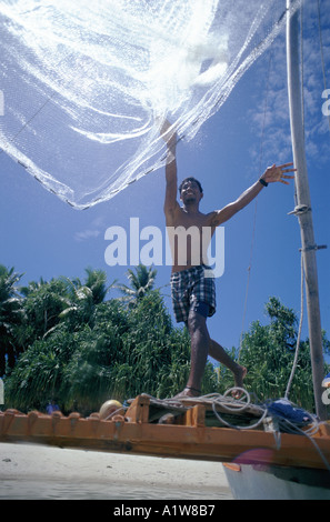 Net Fisherman throwing net in the Marshall Islands in the Western Pacific Stock Photo
