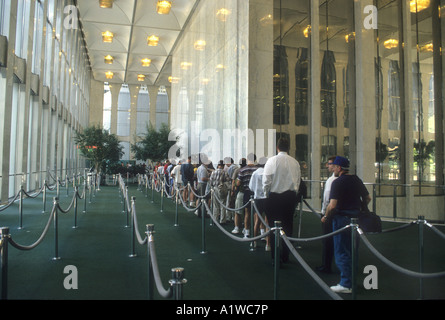 Visitors waiting in line to go into the Louis Vuitton and Nike Air