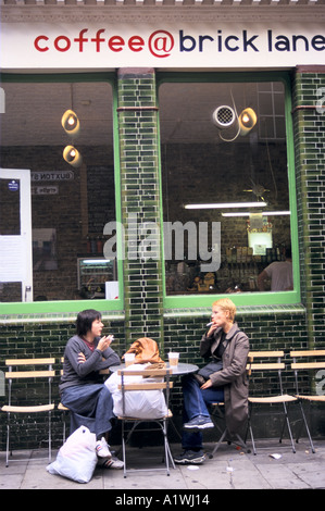 Couple having drink at pavement cafe,COFFEE @ BRICK LANE 2000 Stock Photo