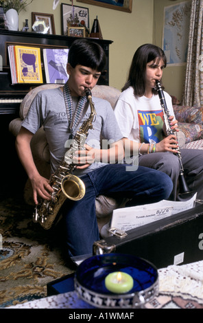 Young FOLLOWERS OF BAHAI RELIGION,playing music AT HOME SCOTLAND 1999 Stock Photo