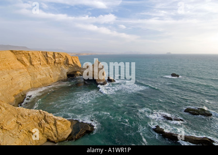 A view of the coast and rock formation known as 'The Cathedral' in the Paracas National Reserve near Pisco, Peru. Stock Photo