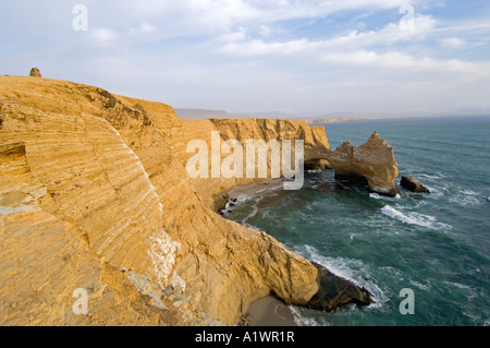 A view of the coast and rock formation known as 'The Cathedral' in the Paracas National Reserve near Pisco, Peru. Stock Photo