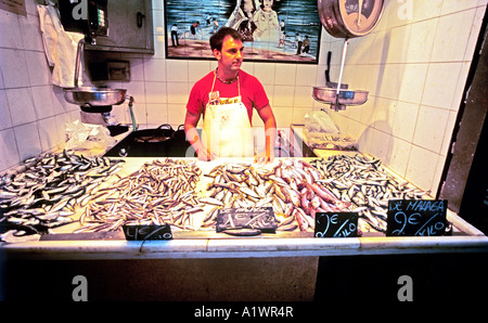 Fishmonger in the Central Market Mercado Central in Malaga Spain Andalusia Europe EU Stock Photo