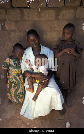 Katakwi Uganda HIV positive mother Mary Goretti Isuuti with her children Ikotit, 5, Apio Angella  3 and Alu Tom aged 9 months Stock Photo