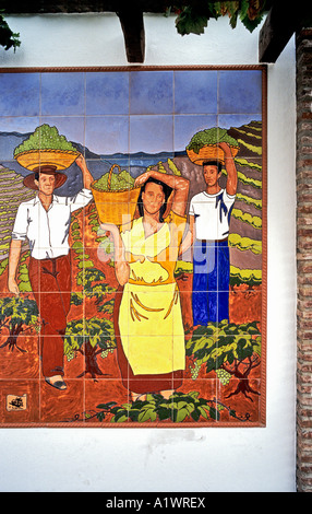 Tiled mural showing grape harvesting in the Competa district Competa Andalusia Spain EU Stock Photo