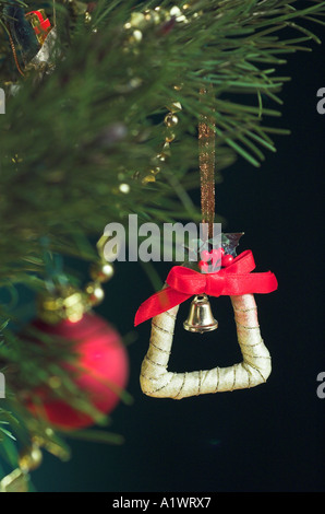Close up of a traditional Christmas tree decoration hanging on a Christmas Tree Stock Photo