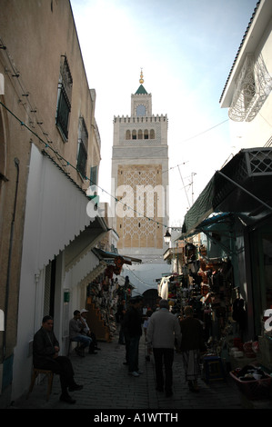 Zitouna Mosque minaret seen from bazaar in Tunis medina, capital of Tunisia Stock Photo