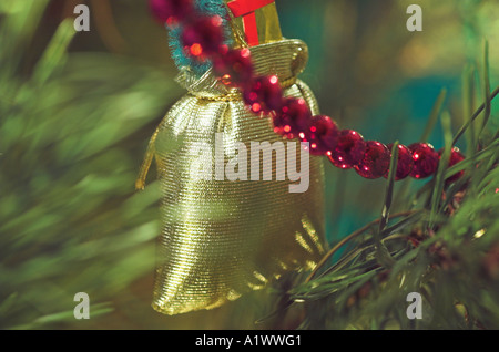 Close up of a traditional Christmas tree decoration hanging on a Christmas Tree Stock Photo