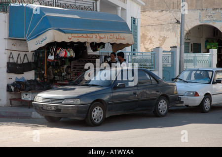 Street and shop with leather bags in Gabes city in Tunisia Stock Photo