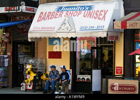 City scene, two elderly men in front of a barber shop, Manhattan, NYC Stock Photo