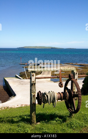 dh newark bay DEERNESS ORKNEY Boat iron wheel winch boat landing blue sea sky Copinsay Island Stock Photo