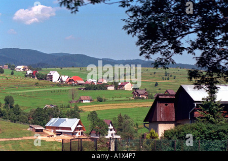 Hillside farms on the way into the Tatra Mountains. Zakopane Poland Stock Photo