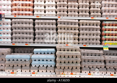 Rows of eggs in a supermarket store refrigerator section of the market Stock Photo