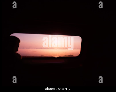 'Transit', Silhouette of man in front of train window, The Netherlands. Stock Photo