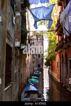 washing hanging out to dry above canal, venice, italy Stock Photo