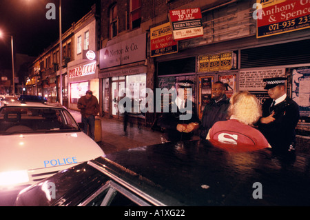 METROPOLITAN POLICE PATROL IN TOTTENHAM FRIDAY NIGHT Stock Photo