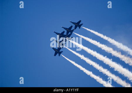 Six FA 18s flown by the US Navy Blue Angels streak across the sky in tight formation Stock Photo