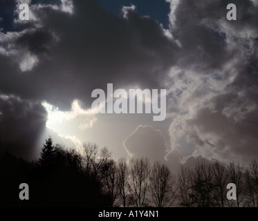 Ray of sunshine breaking through heavy clouds. Stock Photo